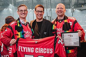 Representatives of the Flying Circus during the signing ceremony of a two-year partnership with the Kölner Haie.